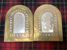 A PAIR OF EASTERN BRASS ARCH TOPPED WALL MIRRORS, 28.5 X 38CMS