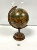 REPRODUCTION OF TERRESTRIAL GLOBE ON CARVED WOODEN STAND, 35CMS APPROX