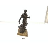 A BRONZE FIGURE OF A BLACKSMITH, 28CMS