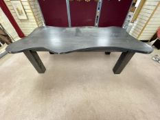 A LARGE EBONISED SHAPED DINING TABLE ON LARGE SQUARE LEGS, 120 X 228CMS