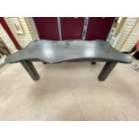 A LARGE EBONISED SHAPED DINING TABLE ON LARGE SQUARE LEGS, 120 X 228CMS