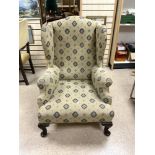 1930S UPHOLSTERED WING BACK ARMCHAIR ON MAHOGANY CABRIOLE LEGS