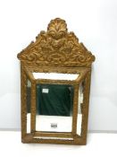 LATE 19TH CENTURY EMBOSSED BRASS CUSHION MIRROR BEVELLED, 58 X 32CMS