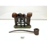 VINTAGE PIPES IN A FENCE GATE DESIGN PIPE RACK