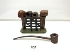 VINTAGE PIPES IN A FENCE GATE DESIGN PIPE RACK