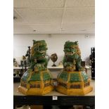 A PAIR OF 20TH CENTURY CHINESE GLAZED DOGS OF FOO GARDEN ORNAMENTS ON OCTAGONAL BASES, 53CMS