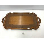 A CARVED EASTERN TWO HANDLE WOODEN TRAY