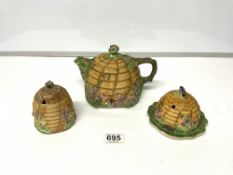 A ROYAL WINTON TEAPOT, AND TWO HONEY POTS (A/F)