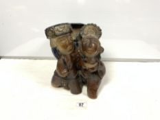 STONEWARE GROUP OF AZTEC MAN AND WOMAN CARRYING A LARGE BASKET, 30CMS WITH ORIGINAL LABEL FOR M.