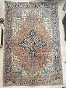 PERSIAN RUST AND BLUE GROUND GEOMETRIC DESIGN CARPET, 290 X 204CMS