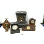 BRITISH MANUFACTURED BRASS TIMEPIECE MOUNTED IN A SHAPED OAK EASEL STAND WITH BRASS CHERUB MOUNT AND