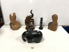 A PAIR OF CARVED WOODEN BALANESE BUSTS, CARVED WOODEN ELEPHANT, CANDLESTICK, AND BLACK ELEPHANT