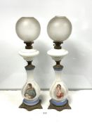 A PAIR OF OPALINE GLASS - NAPOLEAN AND JOSEPHINE PORTRAIT TABLE OIL LAMPS, WITH ORNATE CAST BRASS