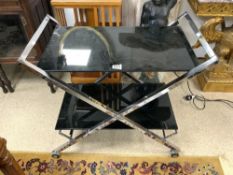 MID-CENTURY CHROME AND TEMPERED BLACK GLASS TWO TIER TROLLEY, 85 X 49CMS