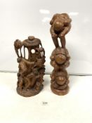 AN AFRICAN CARVED GROUP OF WORKING FIGURES, 39CMS AND A BALANESE FIGURE TOTUM STYLE FIGURE, 52CMS