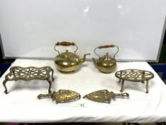 TWO BRASS KETTLES, AND FOUR BRASS TRIVETS