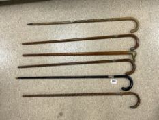 SIX WALKING STICKS SOME WITH HALLMARKED SILVER COLLARS