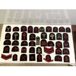 A QUANTITY OF MILITARY CLOTH BADGES, AND BADGES MOUNTED ON CARD FOR SARGENT