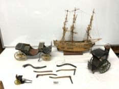 A WOODEN MODEL OF A GALLEON, TWO PAINTED MODELS OF HORSEDRAWN CARRIAGES (A/F), AND A SMALL METAL