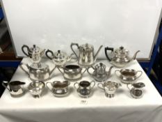 TWO FOUR-PIECE SILVER-PLATED TEA SETS AND TWO THREE-PIECE SILVER-PLATED TEA SETS
