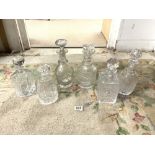 SIX VARIOUS CUT GLASS WHISKY AND SHERRY DECANTERS