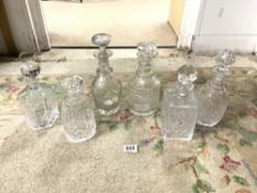 SIX VARIOUS CUT GLASS WHISKY AND SHERRY DECANTERS