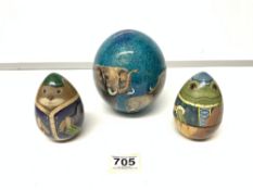 A PAINTED OSTRICH EGG, AND PAINTED EGG-SHAPE ORNAMENTS