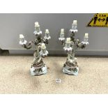 PAIR OF SITZENDORF PORCELAIN FLORAL ENCRUSTED FIGURAL CANDELABRA (A/F), 43CMS