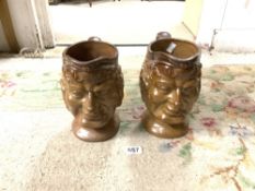 A PAIR OF ANTIQUE STONEWARE CHARACTER JUGS, 23CMS