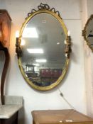 VICTORIAN GILT OVAL MIRROR DECORATED WITH CANDLES (LIGHTS) WITH A MERCURY MIRROR, 108 X 64CMS