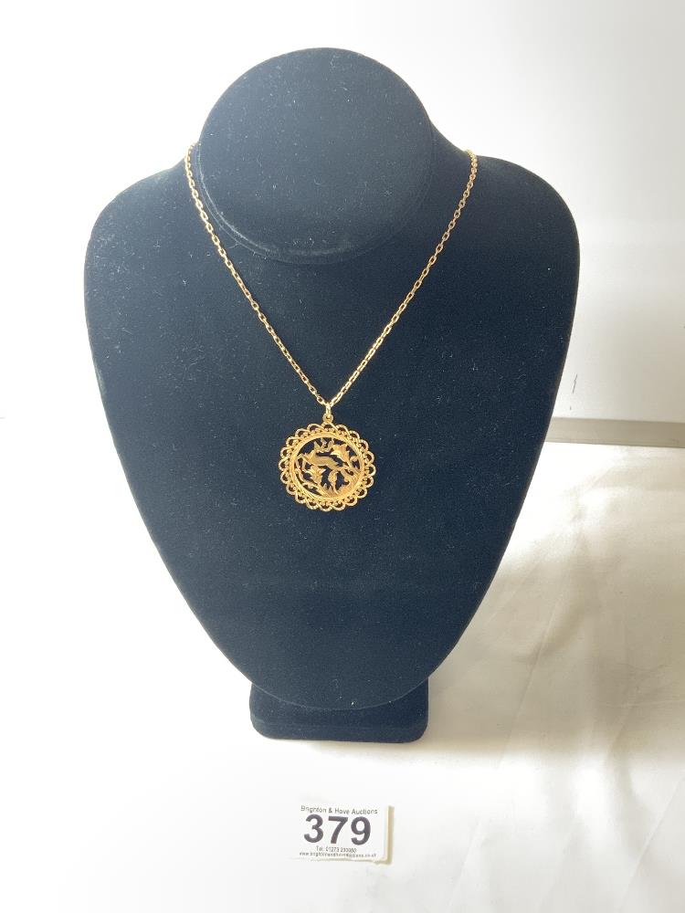 14K GOLD CHAIN WITH A HIGH CARAT UNMARKED GOLD PENDANT, 10 GRAMS