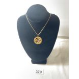 14K GOLD CHAIN WITH A HIGH CARAT UNMARKED GOLD PENDANT, 10 GRAMS