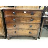 A LATE GEORGIAN MAHOGANY CHEST OF FIVE GRADUATING DRAWERS WITH EBONISED BUN HANDLES ON BRACKET FEET,