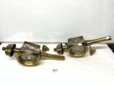 A PAIR OF ANTIQUE BRASS COACHING LAMPS CONVERTED TO WALL LAMPS