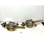 A PAIR OF ANTIQUE BRASS COACHING LAMPS CONVERTED TO WALL LAMPS