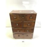 A 19TH CENTURY MINIATURE MAHOGANY BRASS BOUND MILITARY DESIGN CHEST OF SEVEN DRAWERS WITH KNOT
