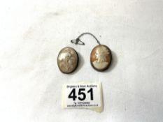 TWO CAMEO BROOCHES IN WHITE METAL MOUNTS IN A VINTAGE LEATHER JEWELLERY BOX