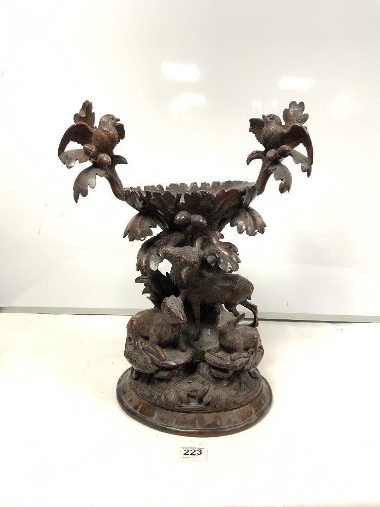 19TH CENTURY CARVED BLACK FOREST CENTRE PIECE WITH STAG, DEER AND BIRDS IN ATTENDANCE, CARVED ACORNS