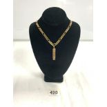 A 750 ITALY STAMPED GOLD KERB LINK CHAIN WITH A PENDANT WITH EGYPTIAN HIEROGLYPHICS DETAILING -