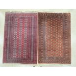 TWO PERSIAN SILK BAKHARA RED GROUND RUGS, BOTH 190 X 126CMS