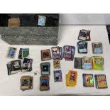 A QUANTITY OF POKEMON AND DIGIMON COLLECTORS CARDS