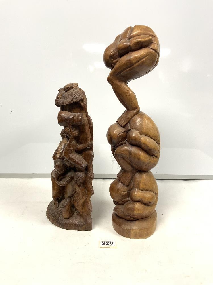 AN AFRICAN CARVED GROUP OF WORKING FIGURES, 39CMS AND A BALANESE FIGURE TOTUM STYLE FIGURE, 52CMS - Image 2 of 4