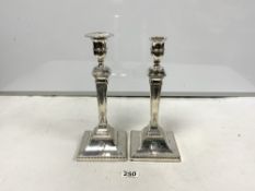 A PAIR OF HALLMARKED WHITE METAL ADAM DESIGN CANDLESTICKS ON SQUARE BASES, ( ONE SCONCE MISSING),