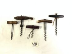 FOUR ANTIQUE WOODEN HANDLED CORK SCREWS AND ONE BONE HANDLED