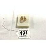 A YELLOW METAL PIERCED DRESS RING, TESTS AS GOLD, 4.1 GRAMS