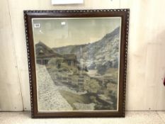 ORIENTAL PICTURE ON SILK OF HOUSES ON THE SIDE OF A MOUNTAIN, 60 X 69CMS