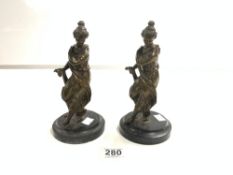 A PAIR OF BRONZE FIGURES OF CLASSICAL FEMALES ON CIRCULAR MARBLE BASES, 22CMS