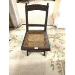 SMALL 19TH CENTURY HEAVILY CARVED MAHOGANY CANE SEAT FOLDING CAMPAIGN CHAIR