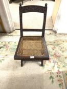 SMALL 19TH CENTURY HEAVILY CARVED MAHOGANY CANE SEAT FOLDING CAMPAIGN CHAIR