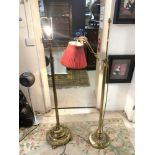 TWO EDWARDIAN BRASS CORINTHIAN COLUMN LAMP STANDS AND FLUTED BASES